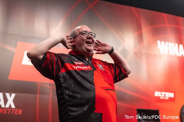 Stephen Bunting lifts his hands to his ears.