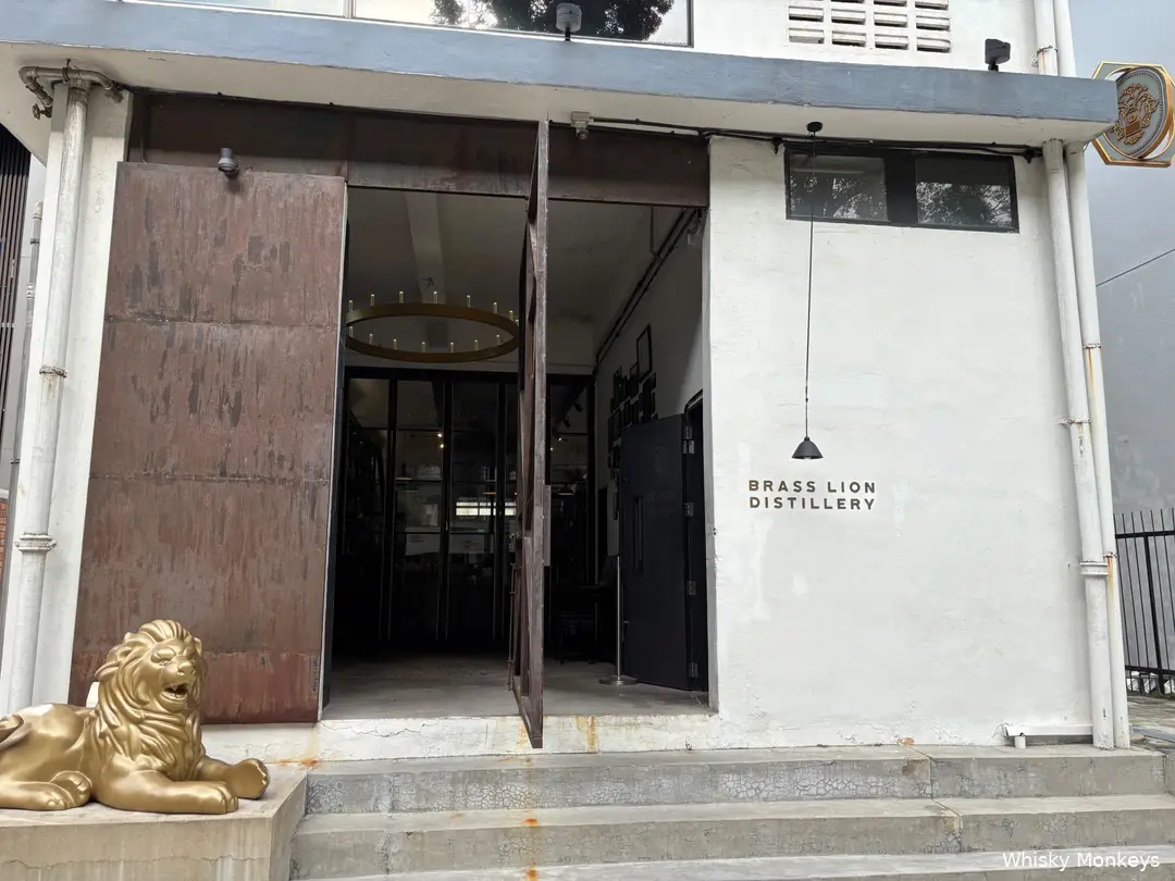 The entrance of Brass Lion Distillery is guarded by a lion