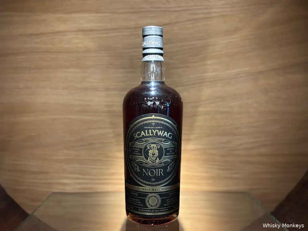 Scallywag Noir bottle in a whisky barrel