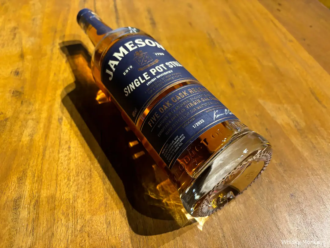 Close-up of label and glass with golden whiskey