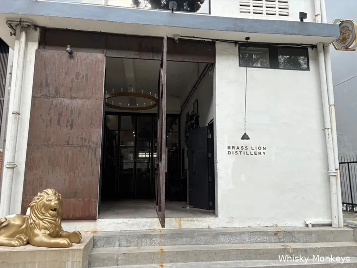 The entrance of Brass Lion Distillery is guarded by a lion