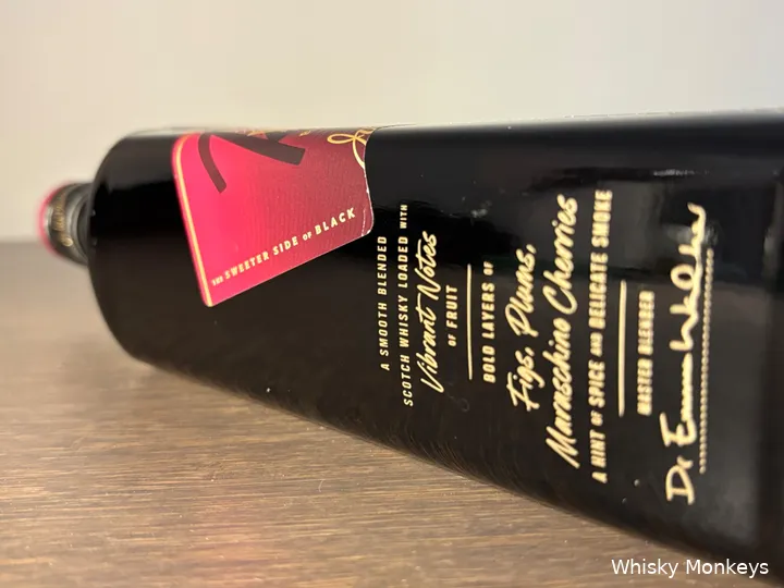 A bottle of Johnnie Walker Black Ruby whisky lying on a table