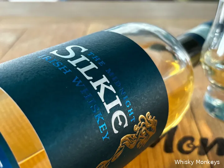 The Midnight Silkie label design in deep blue with the gold mermaid emblem