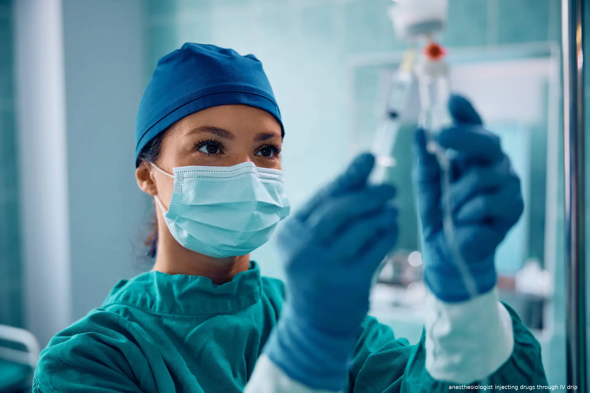 anesthesiologist injecting drugs through IV drip
