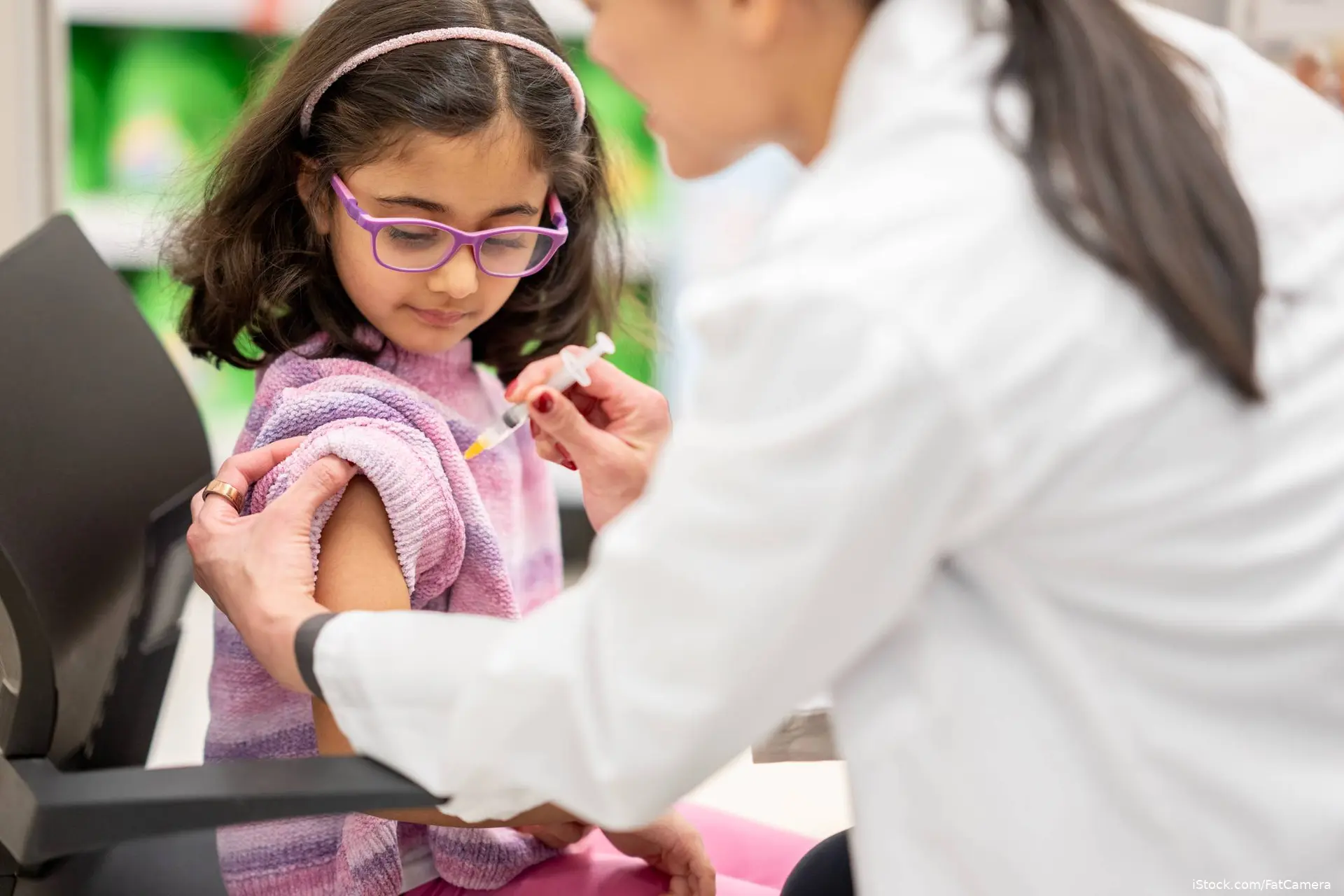 Young girl getting a flu vaccination