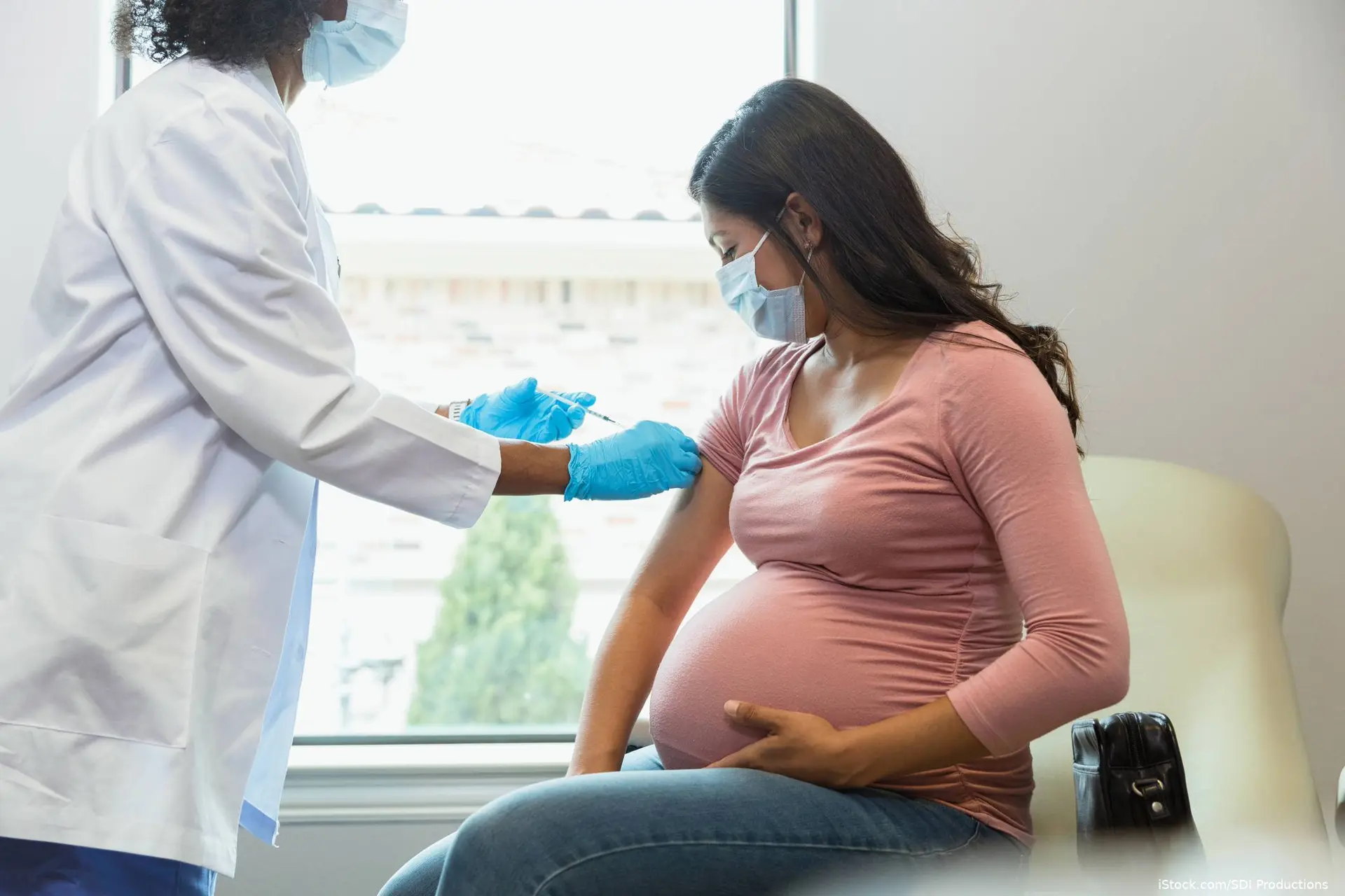 Pregnant woman getting a flu vaccine