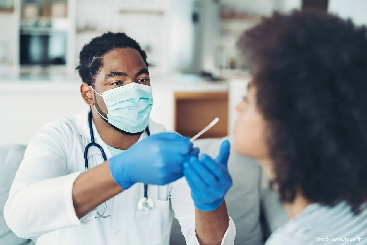 Doctor doing nasal swab on patient