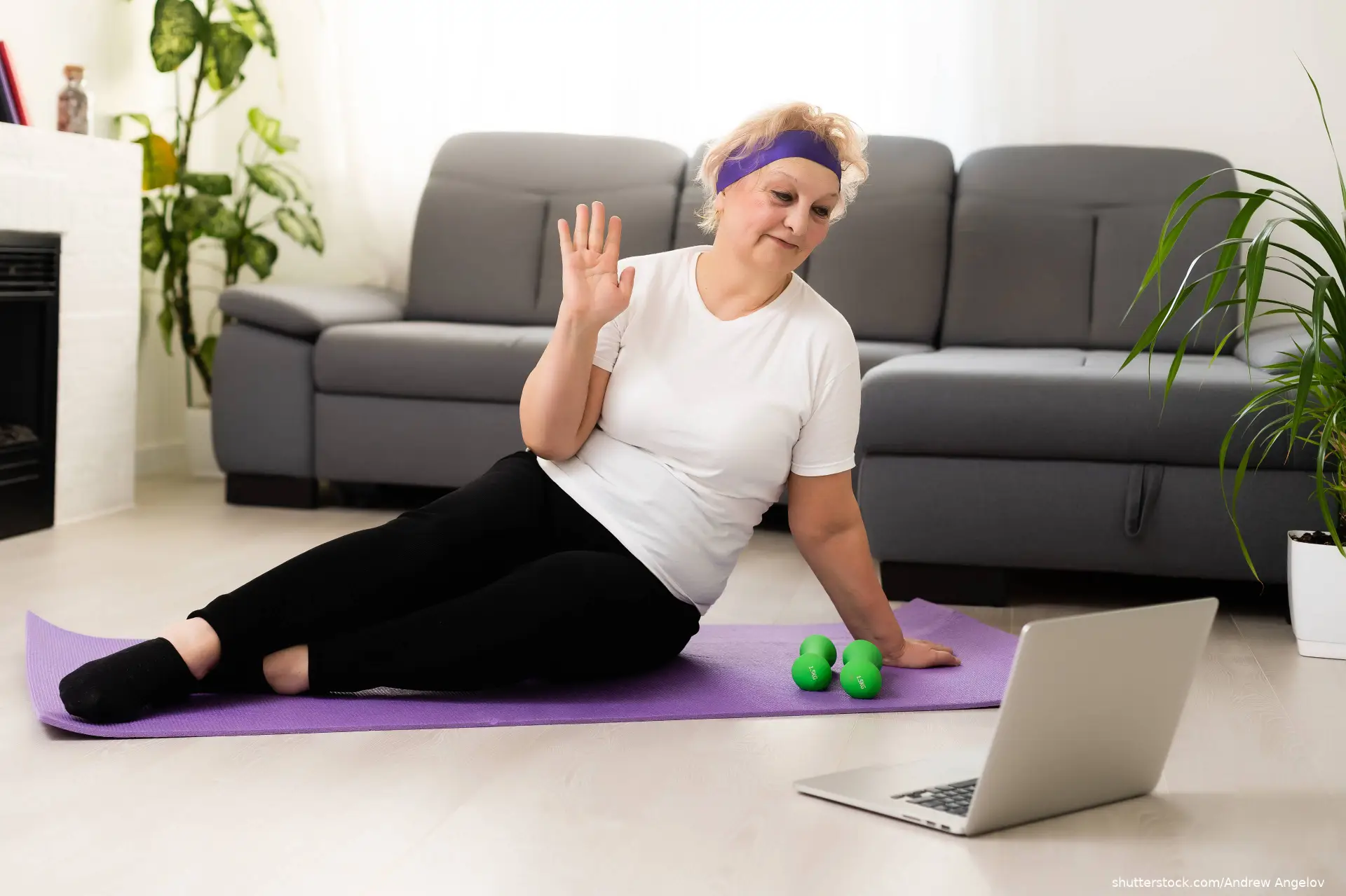 Senior woman exercise using laptop online instructions shutterstock_1905439765