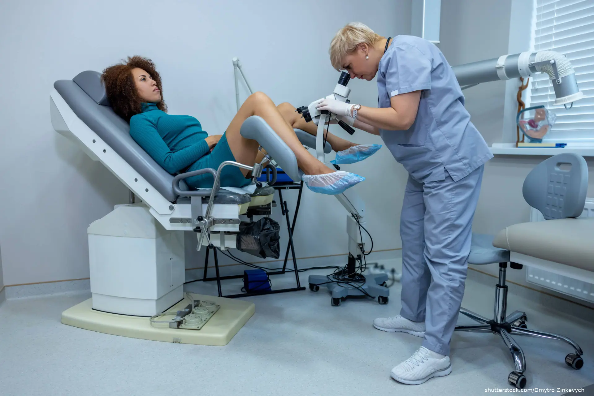 gynecologist doing colposcopy to a woman