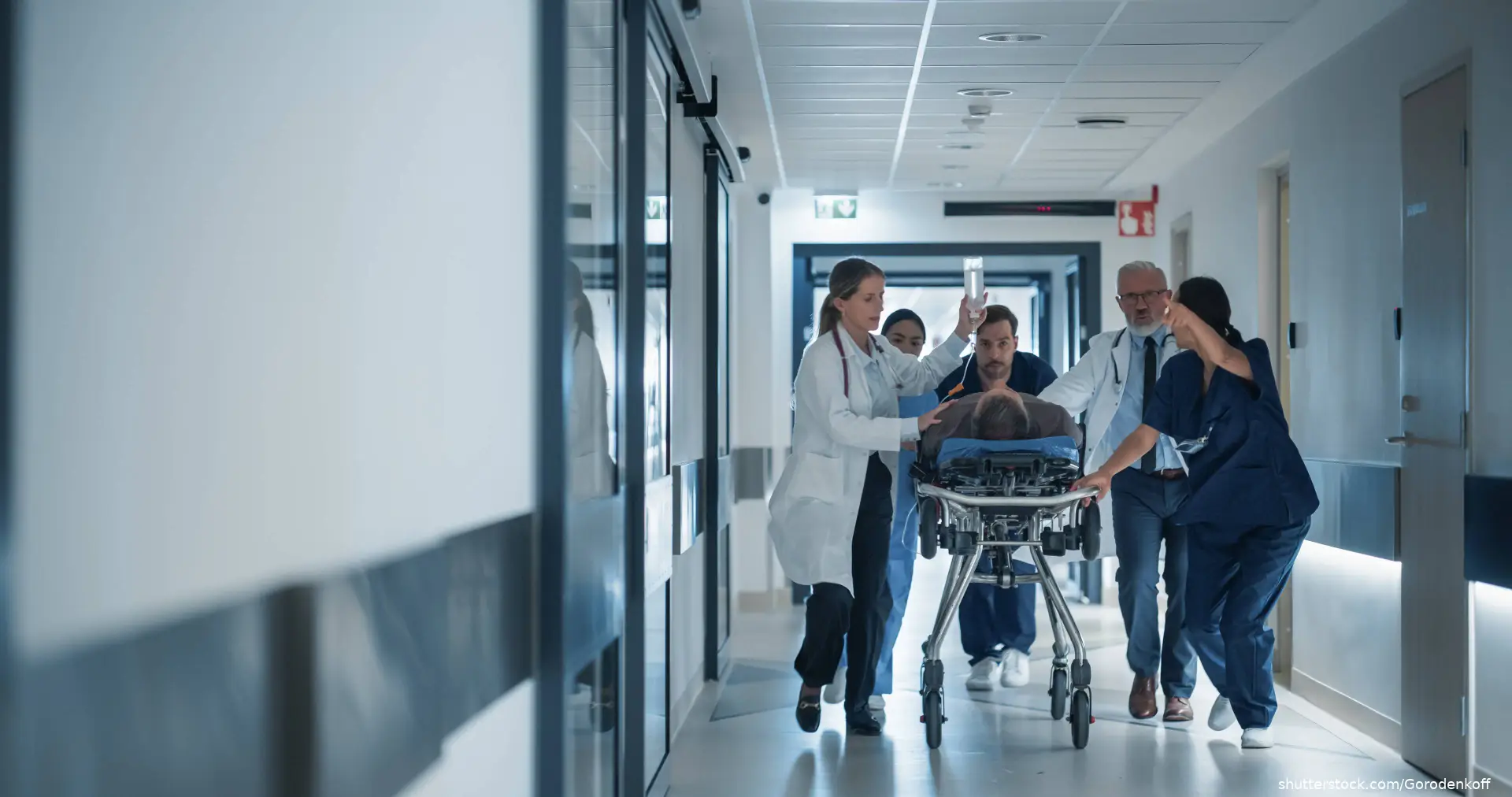 Emergency room staff rushing patient in for treatment