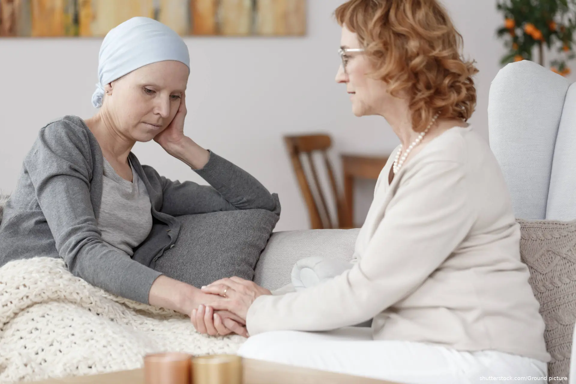 Worried woman with blue scarf on her head