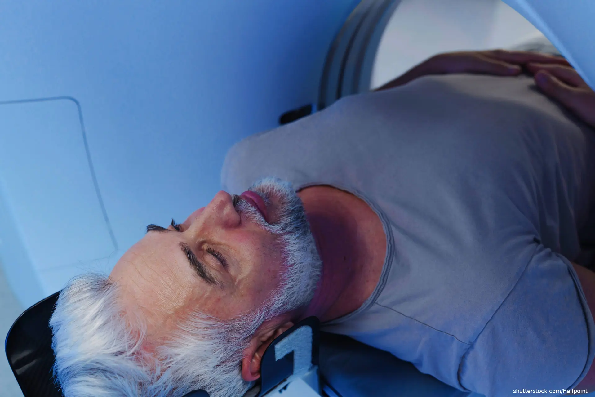 Male patient undergoing CT scan examination in hospital