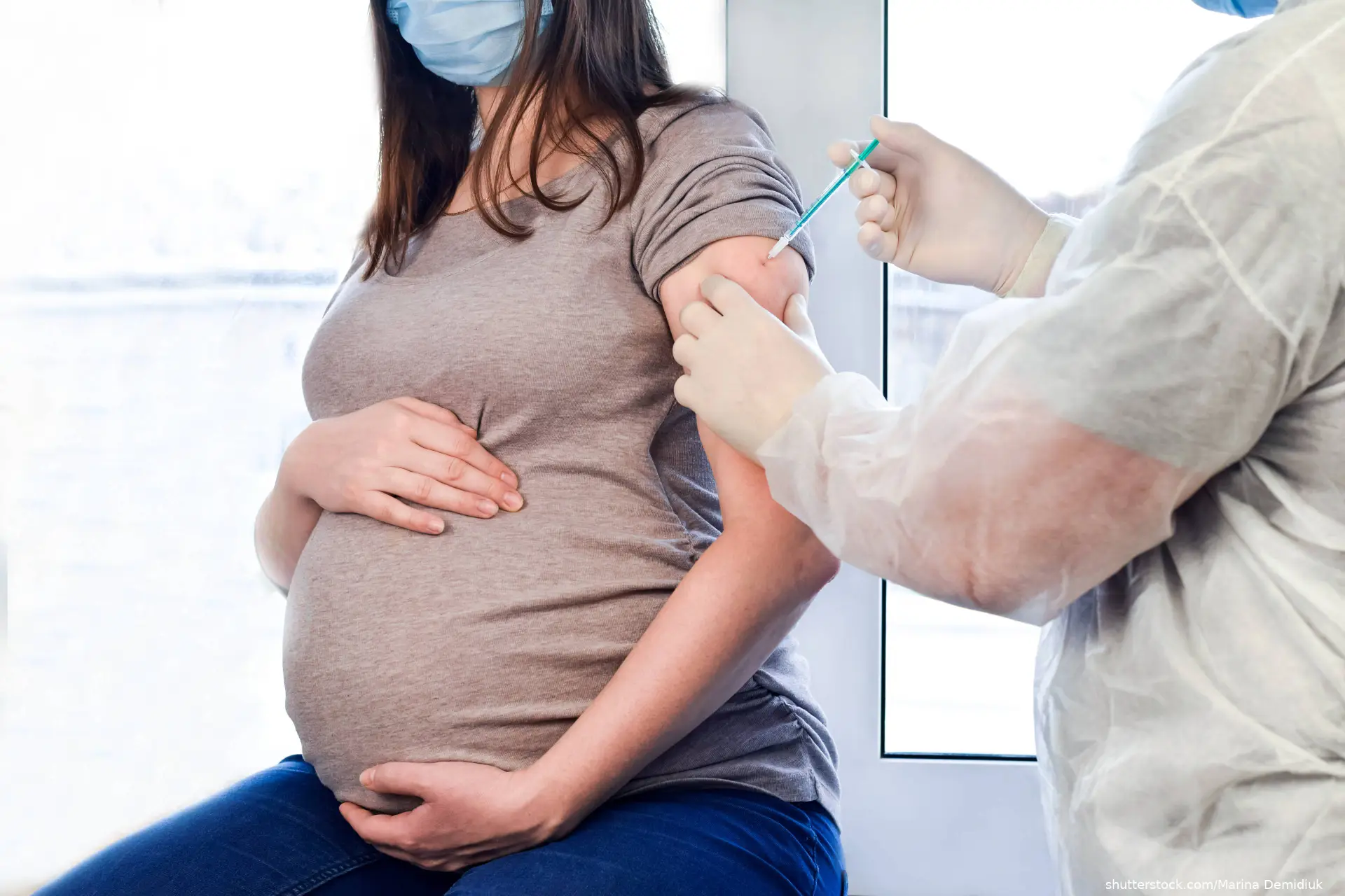 pregnant woman receiving a vaccine