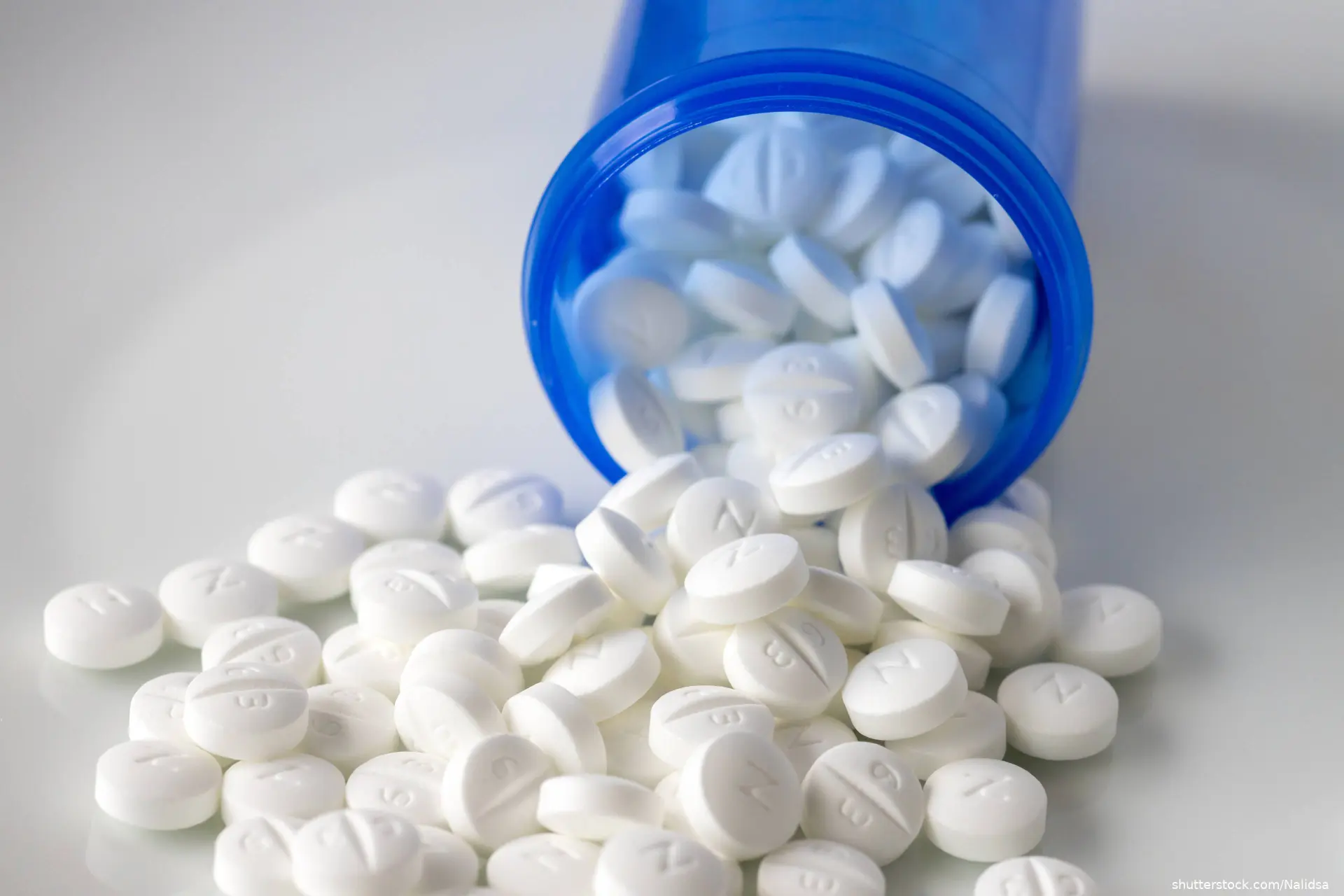 metformin tablets spilling out of a prescription bottle