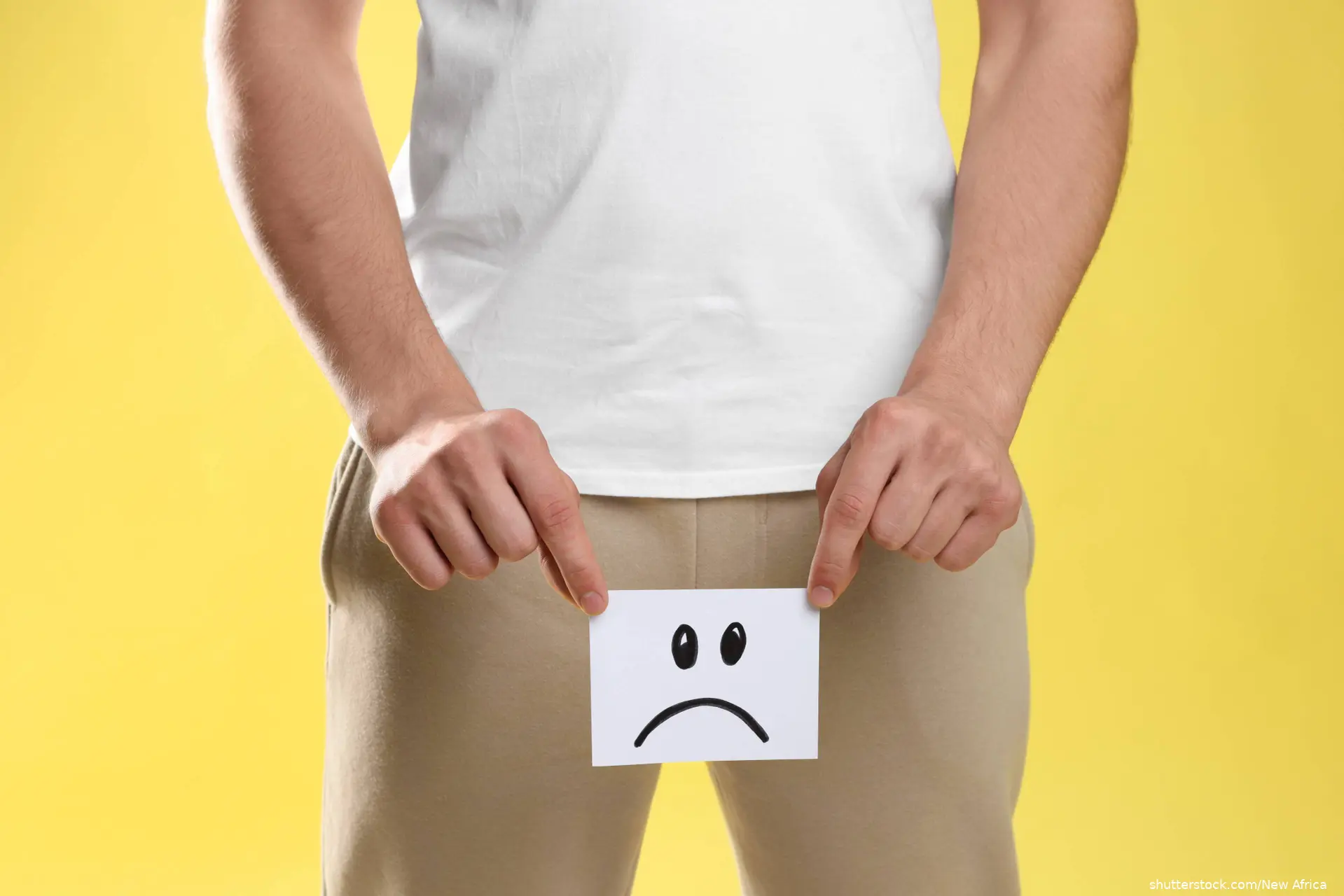 STD. Man holding sticky note with drawn sad face