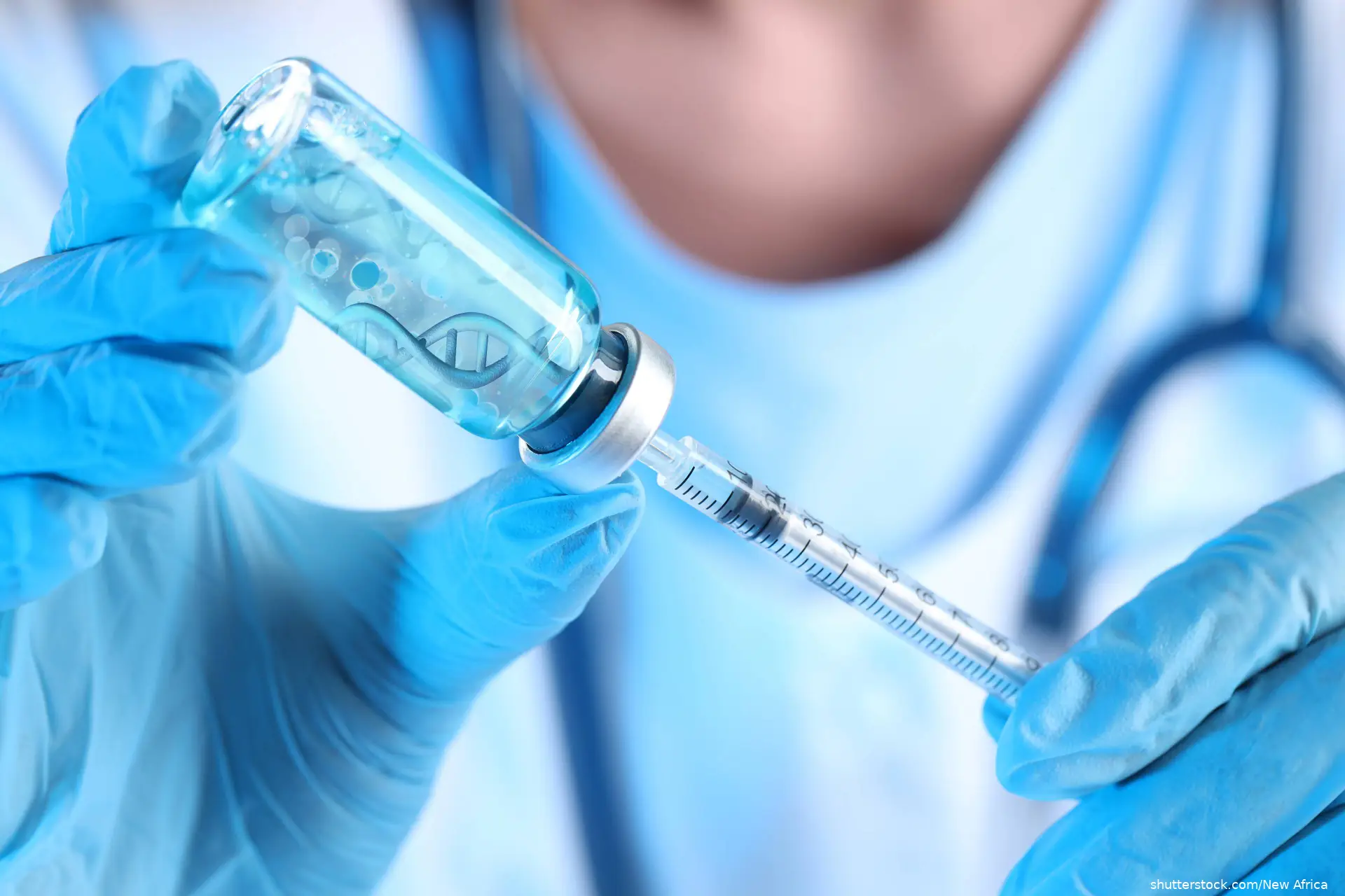 Scientist drawing vaccine from vial with syringe, closeup. DNA strand in liquid shutterstock_2718452975