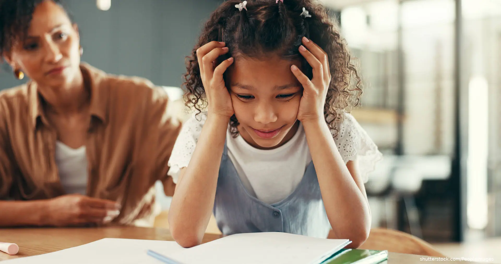 distressed young girl holding her head looking confused