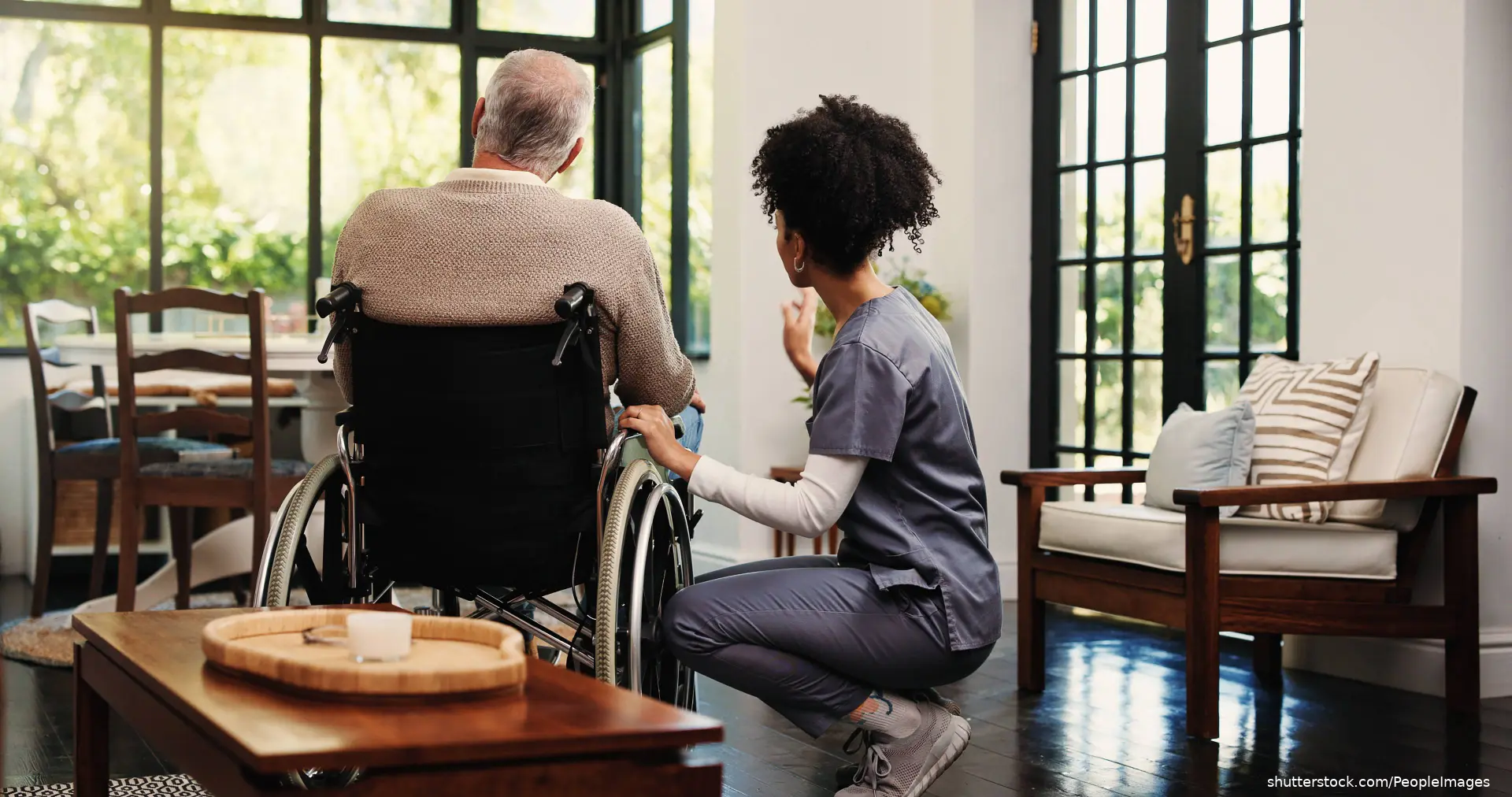 man in wheelchair with nurse
