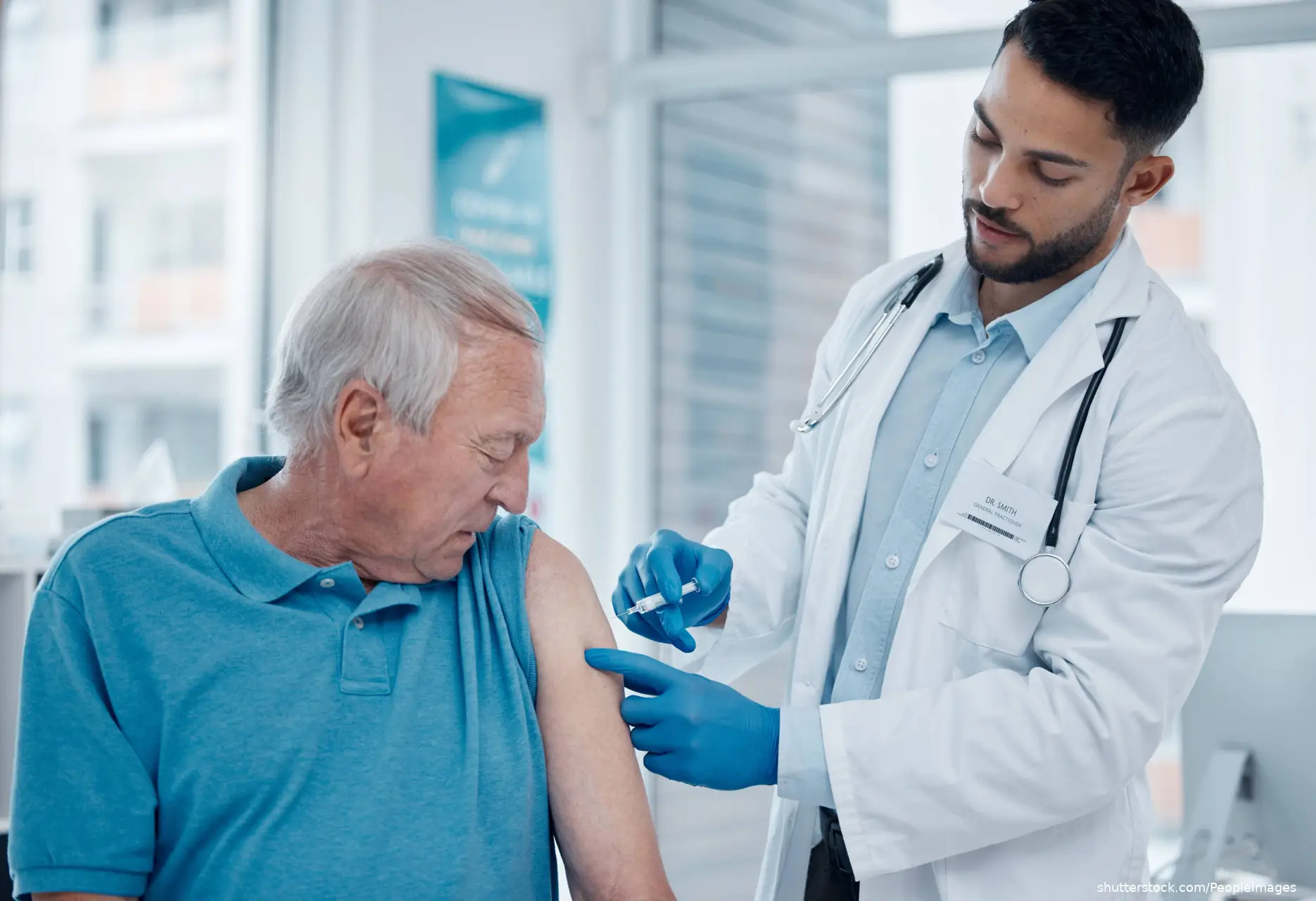 doctor giving vaccine to male patient