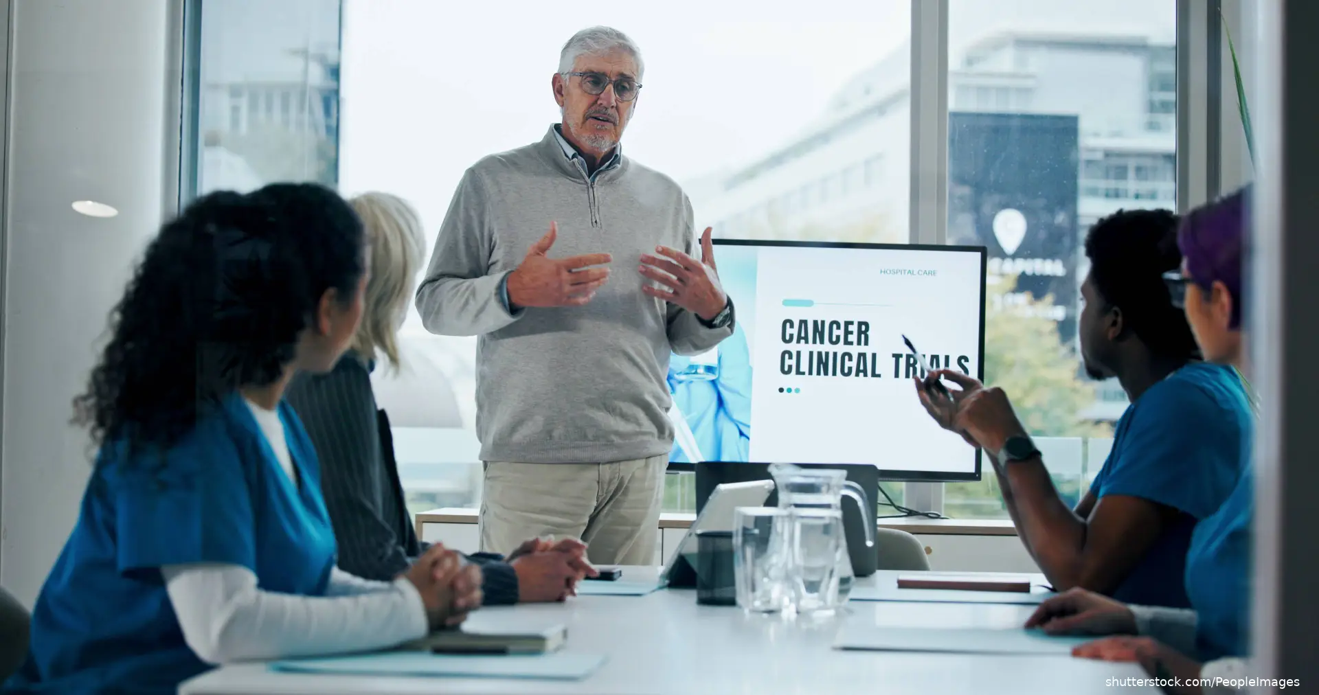 Doctor talking to cancer patient shutterstock_2668796347