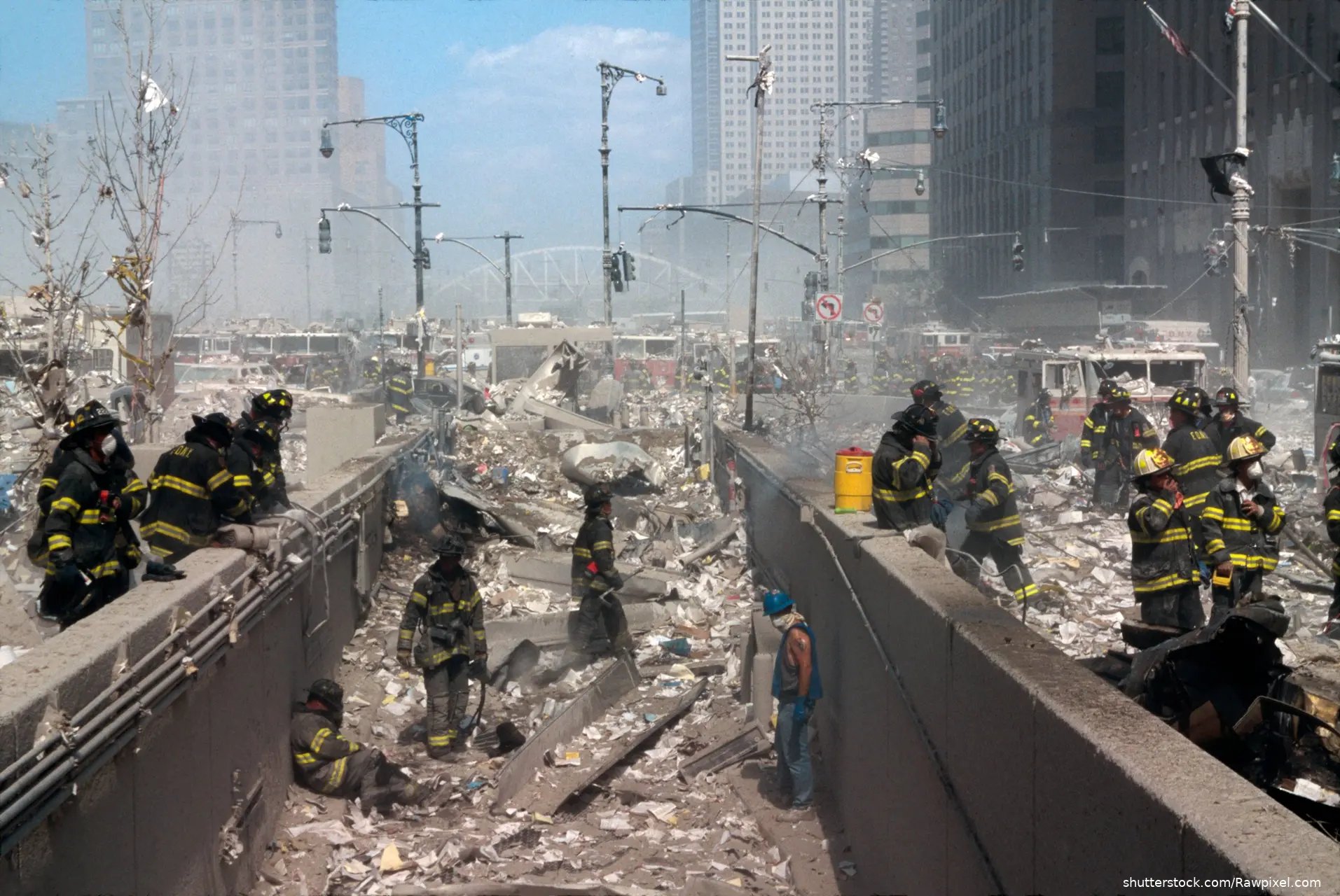 firefighters searching through rubble after 9/11 attack