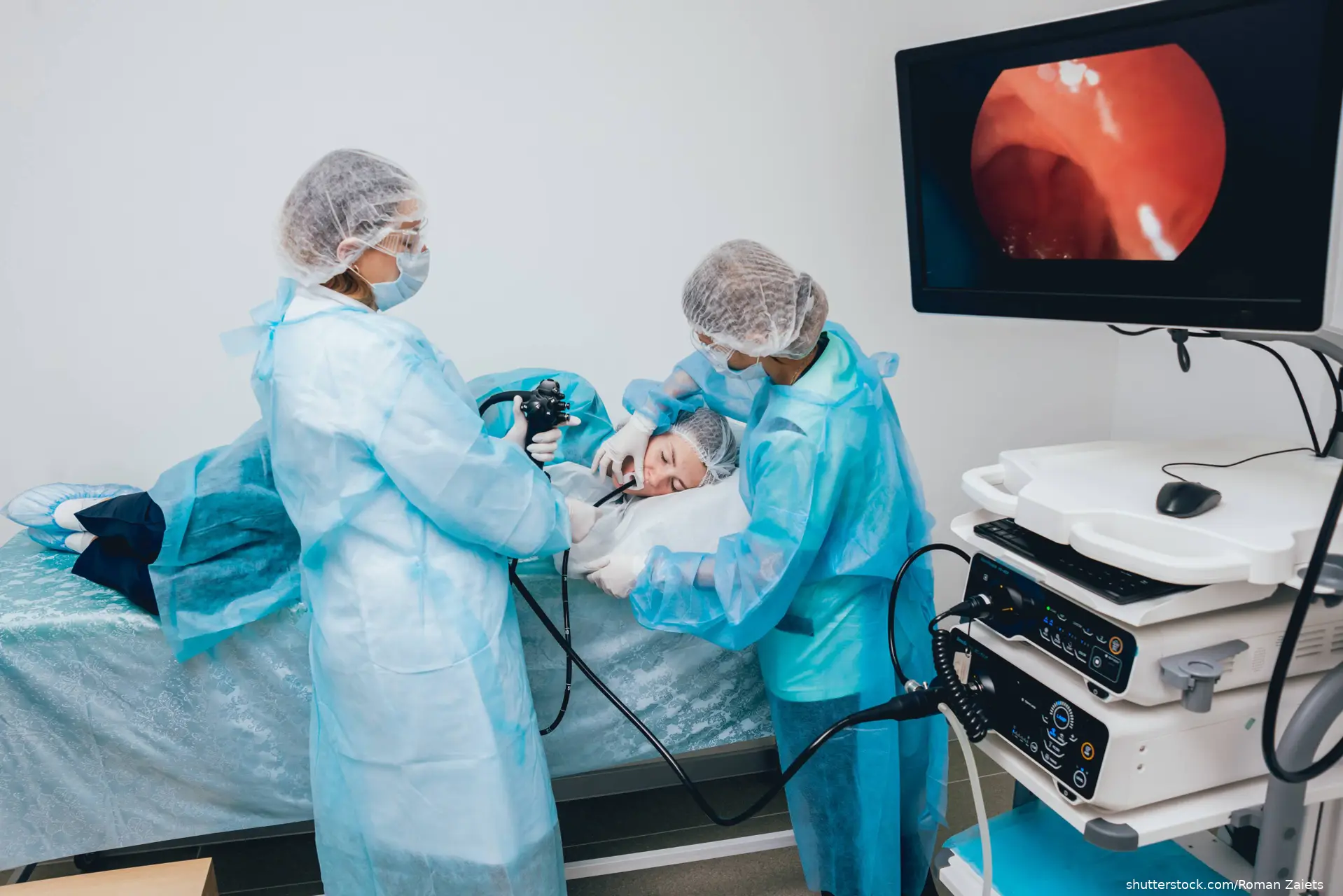 oncologist performing upper endoscopy on patient