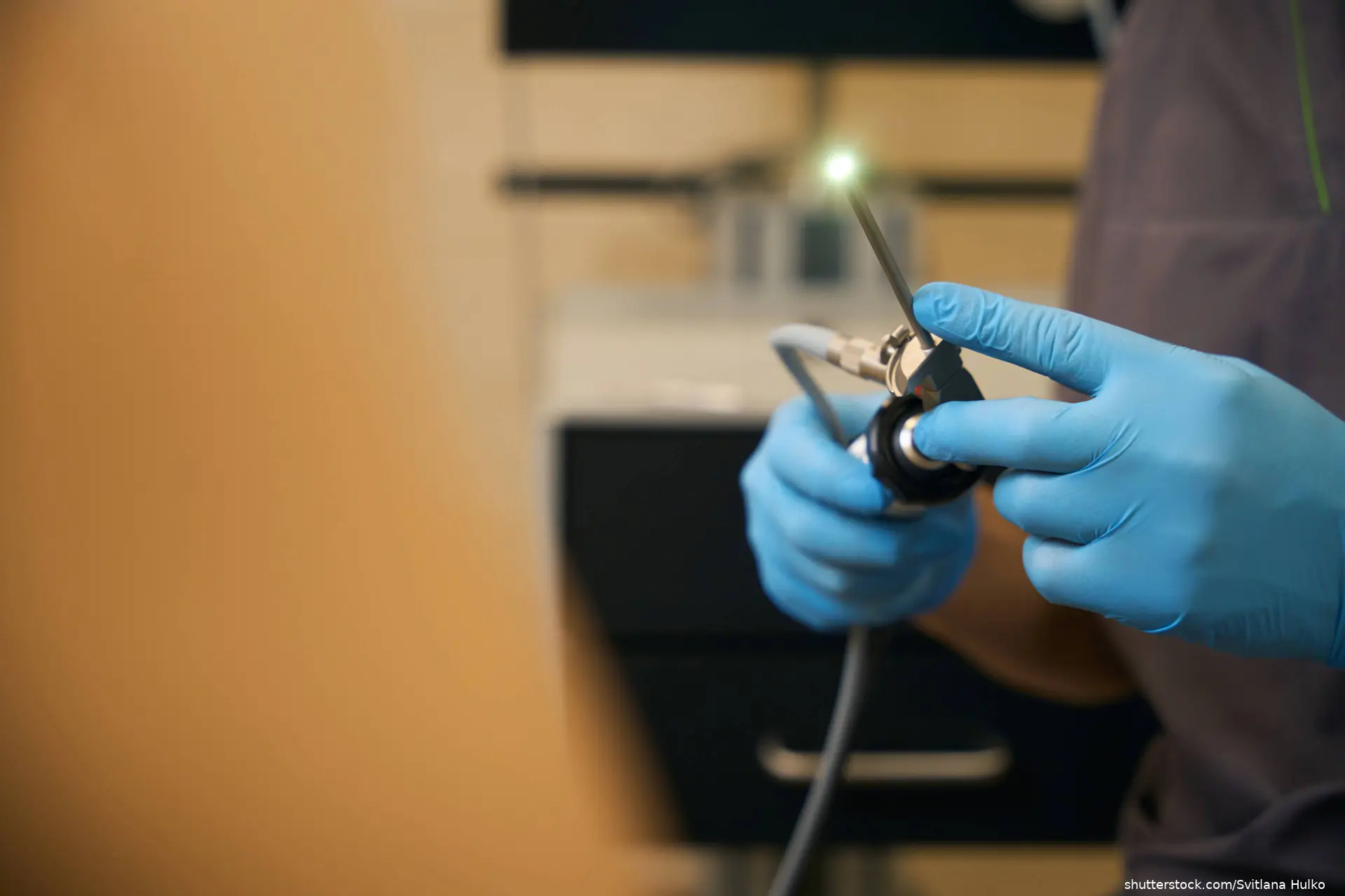 Experienced proctologist is preparing for anoscopy procedure
