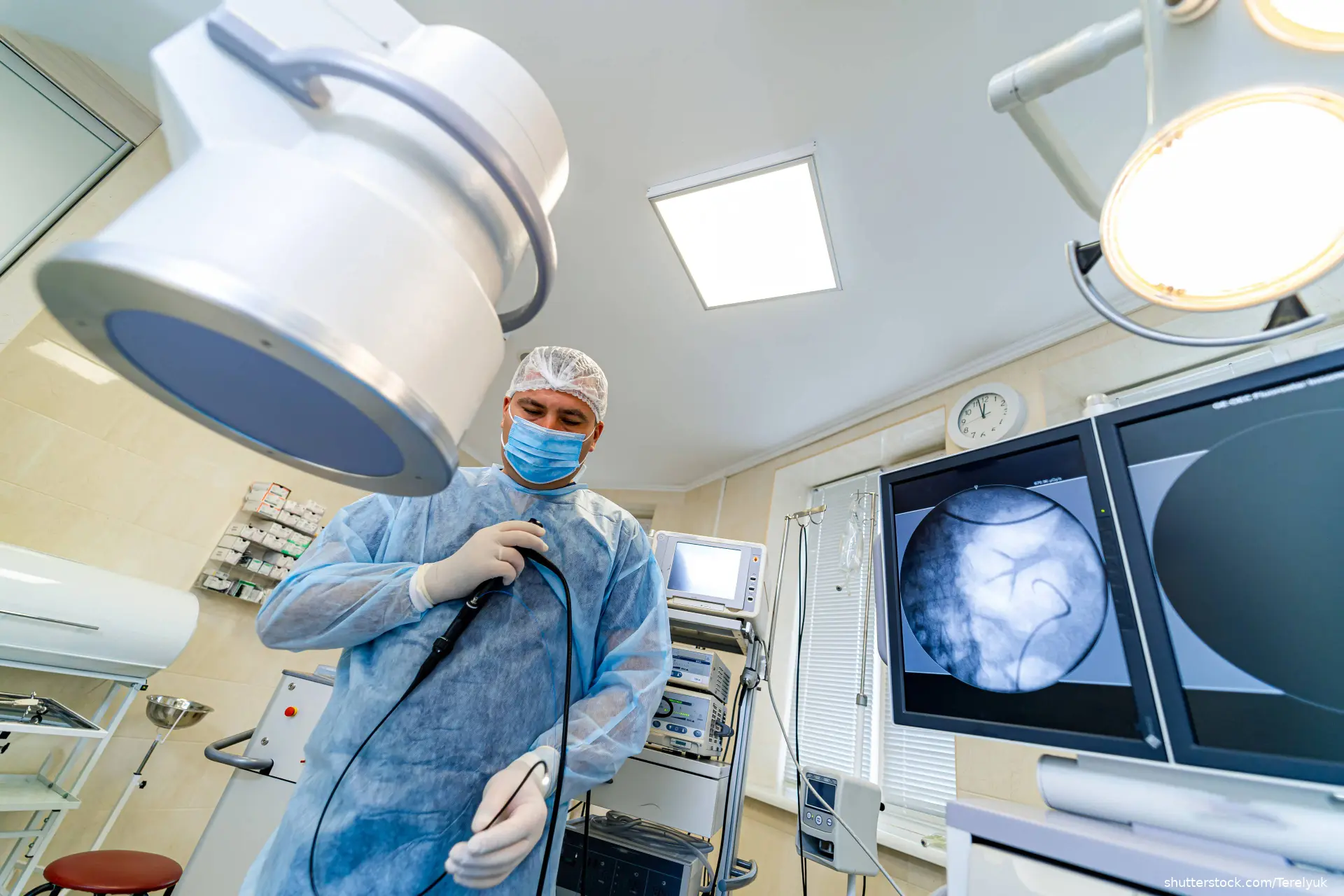 doctor in OR performing a colonoscopy