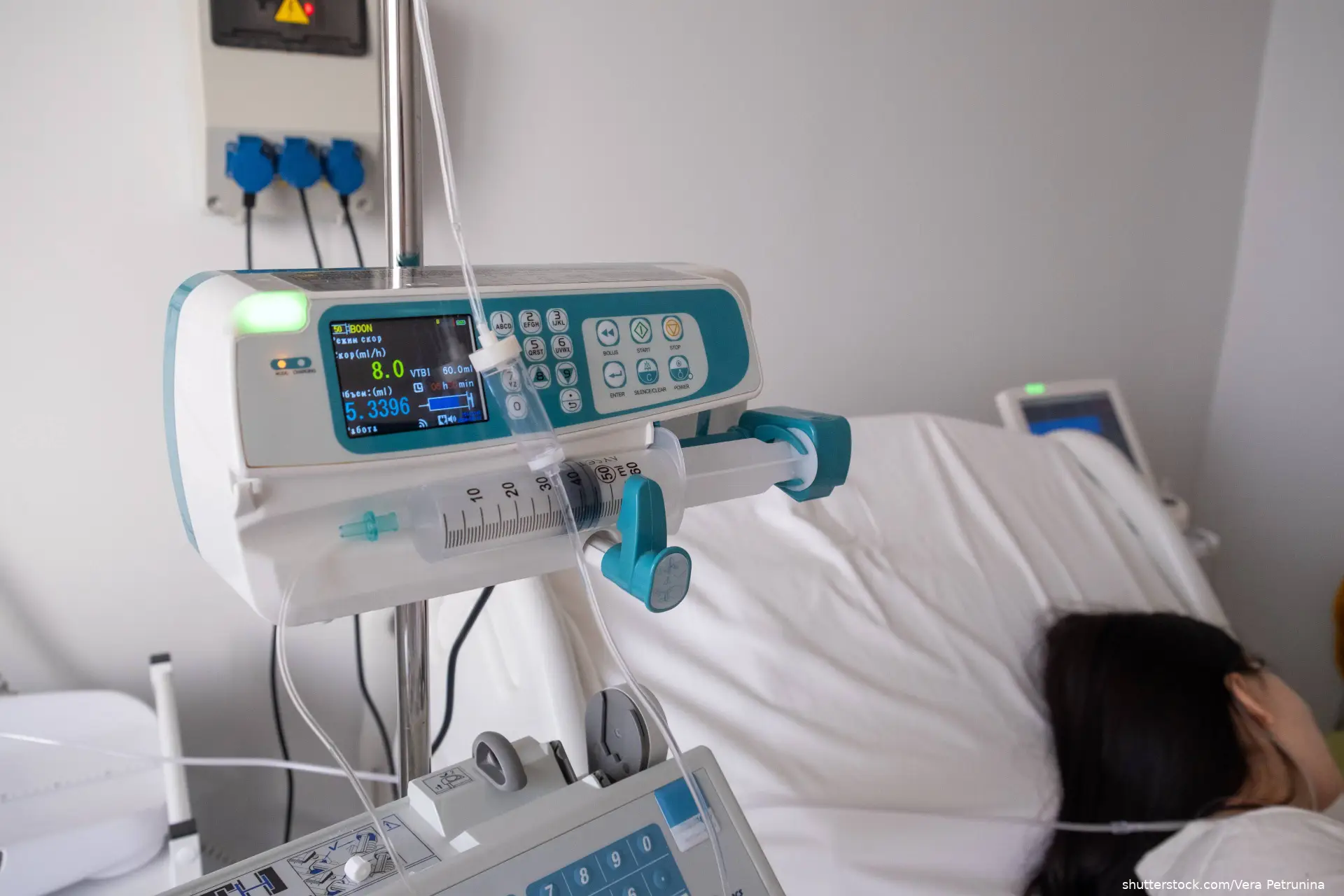 Hospital Room with Infusion Pump and Patient