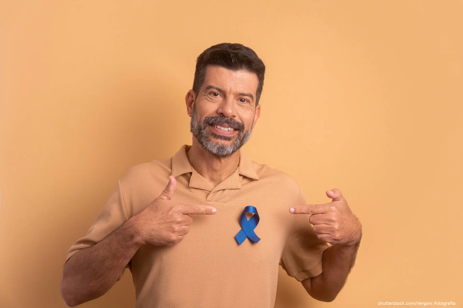 man wearing blue ribbon for prostate cancer