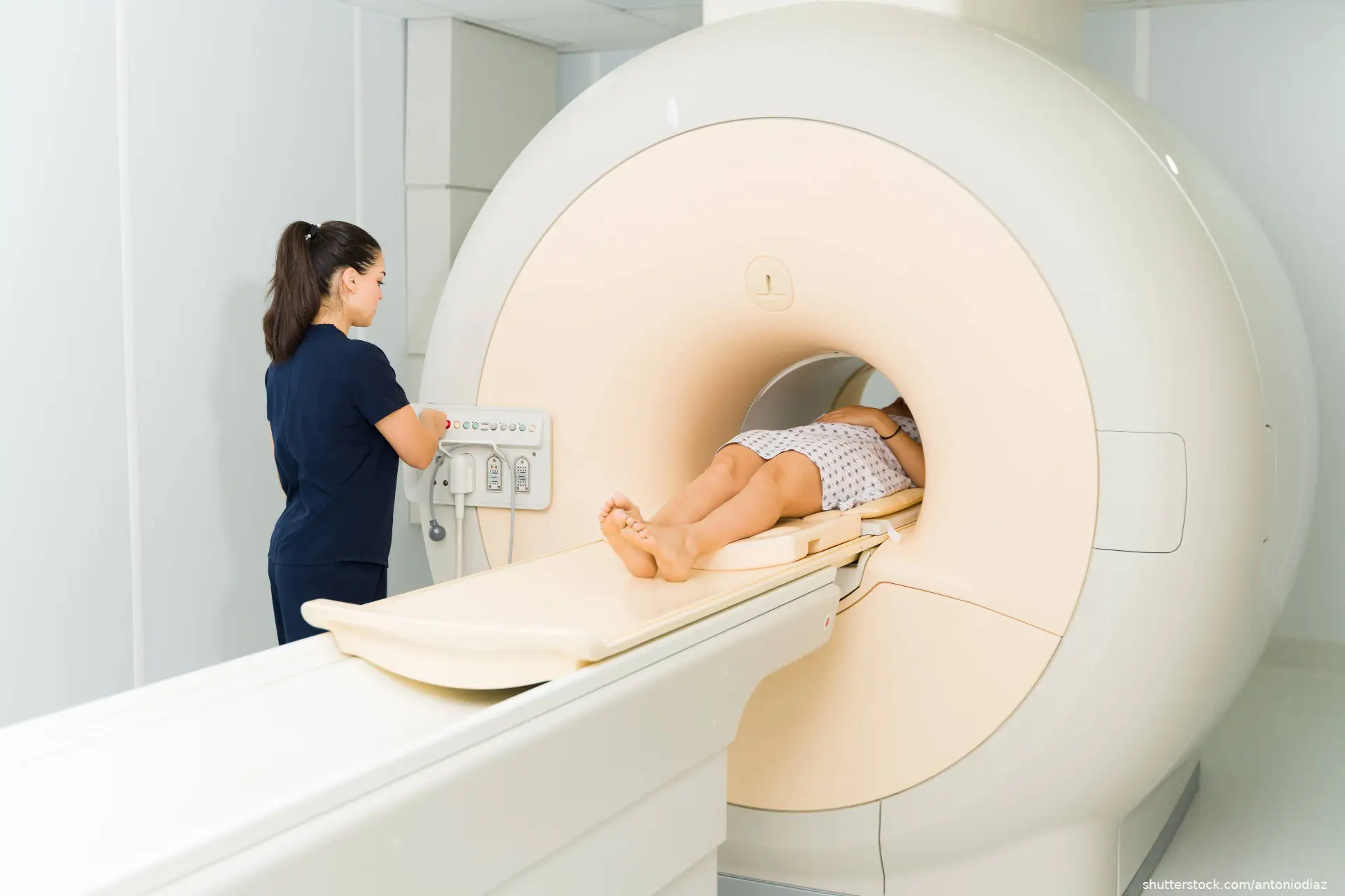 radiologist setting patient up for MRI