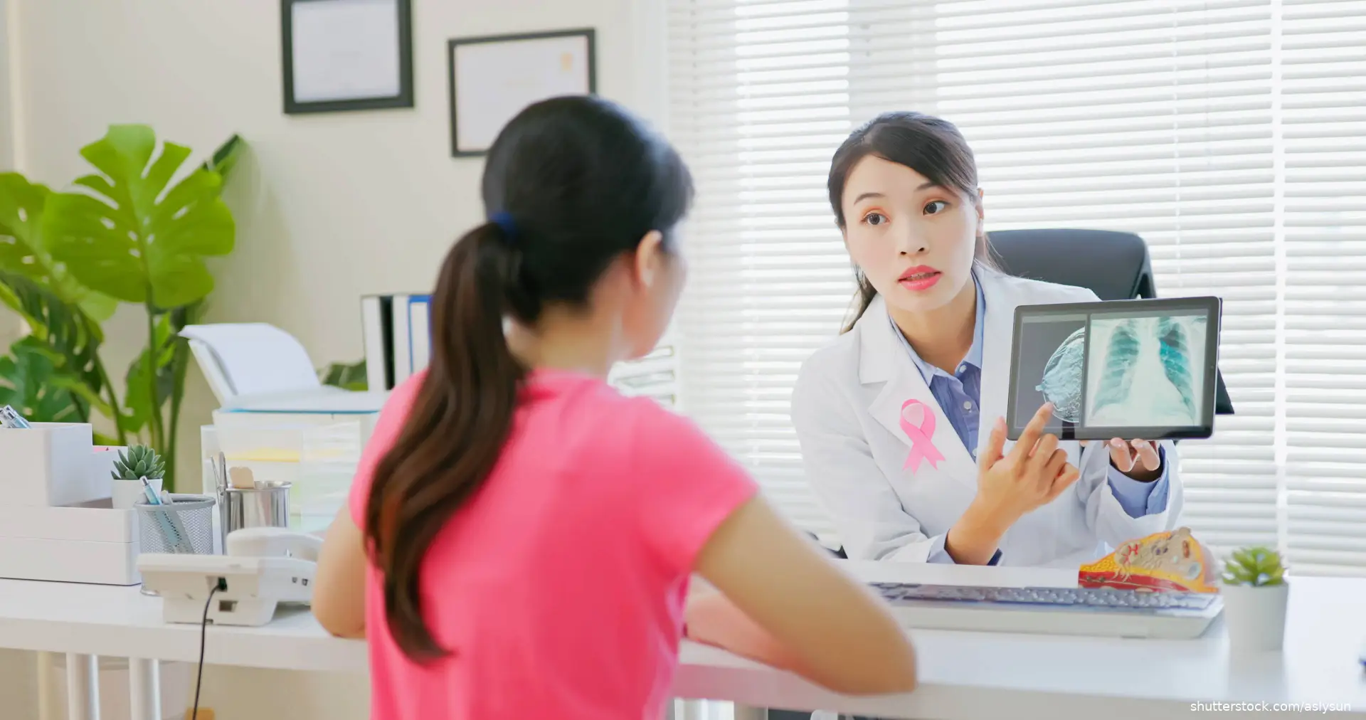 doctor discussing breast cancer with patient