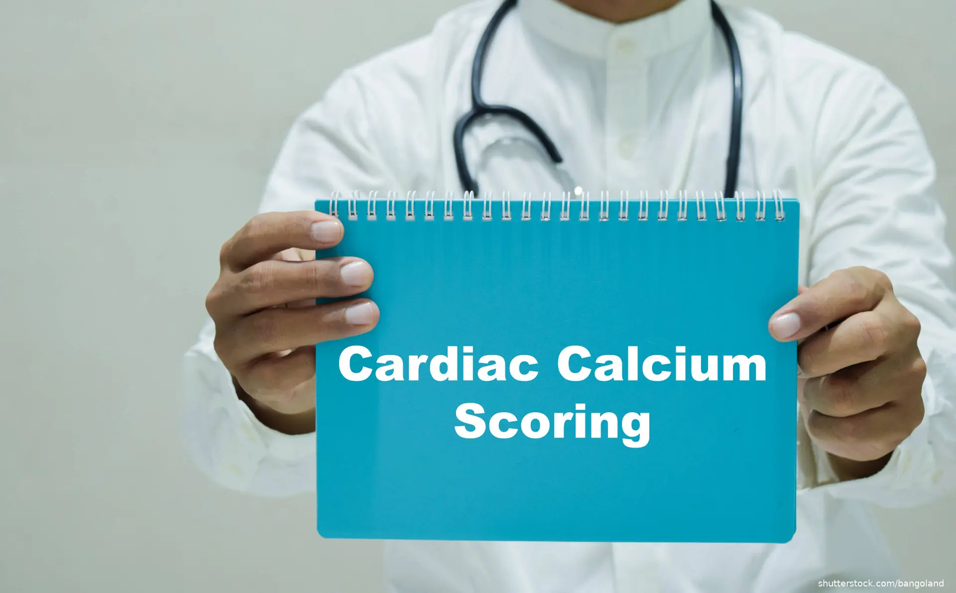 doctor holding a notebook that reads cardiac calcium scoreing