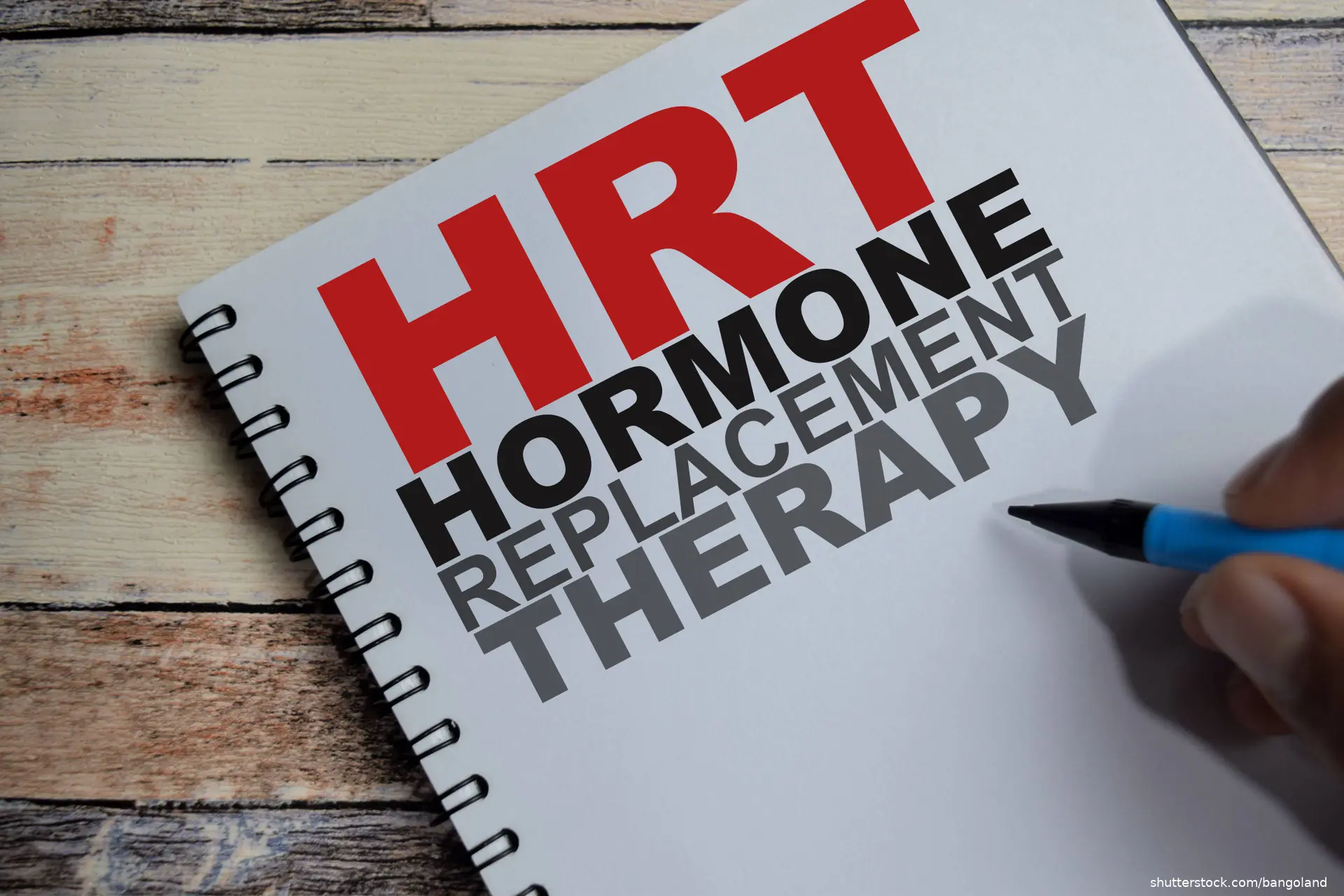 hormone replacement therapy write on book isolated on Wooden Table.