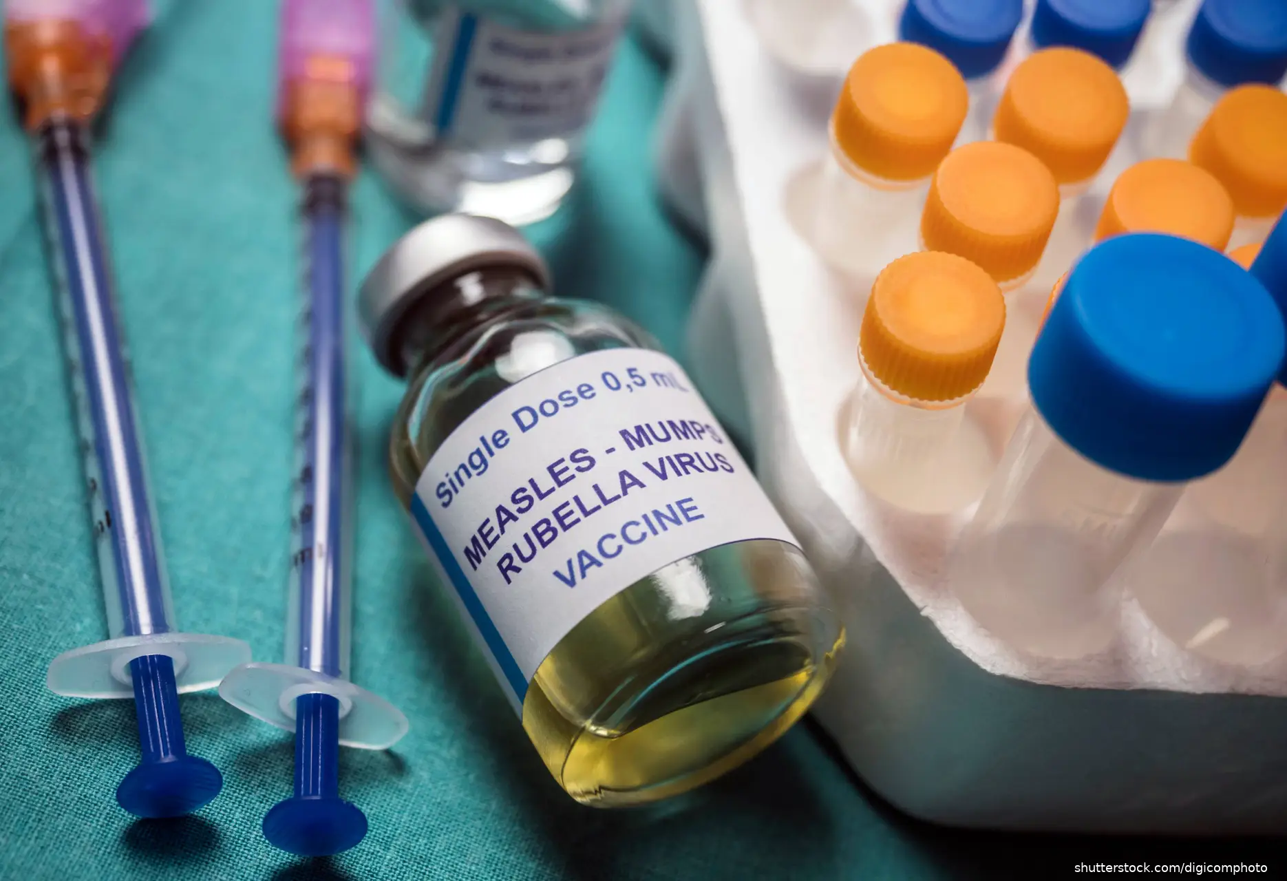 measles, mumps and rubella vaccine vial and syringes