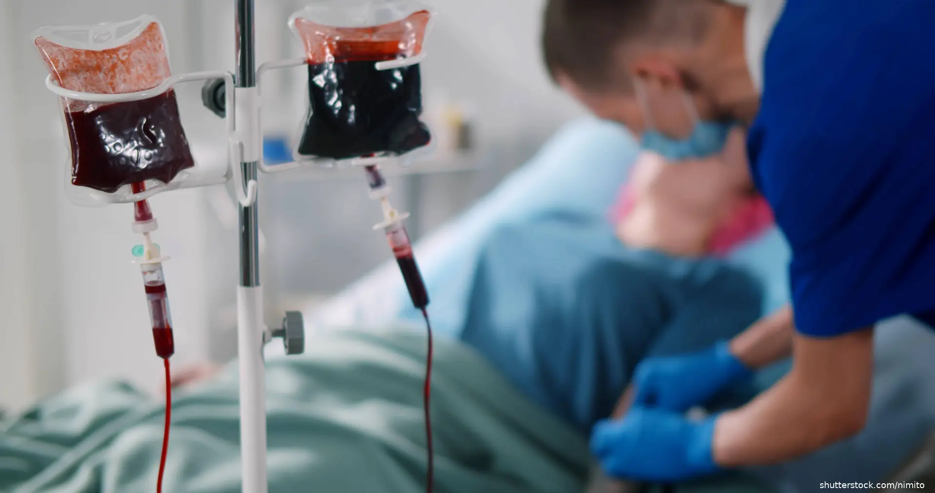 patient in hospital bed getting a transfusion