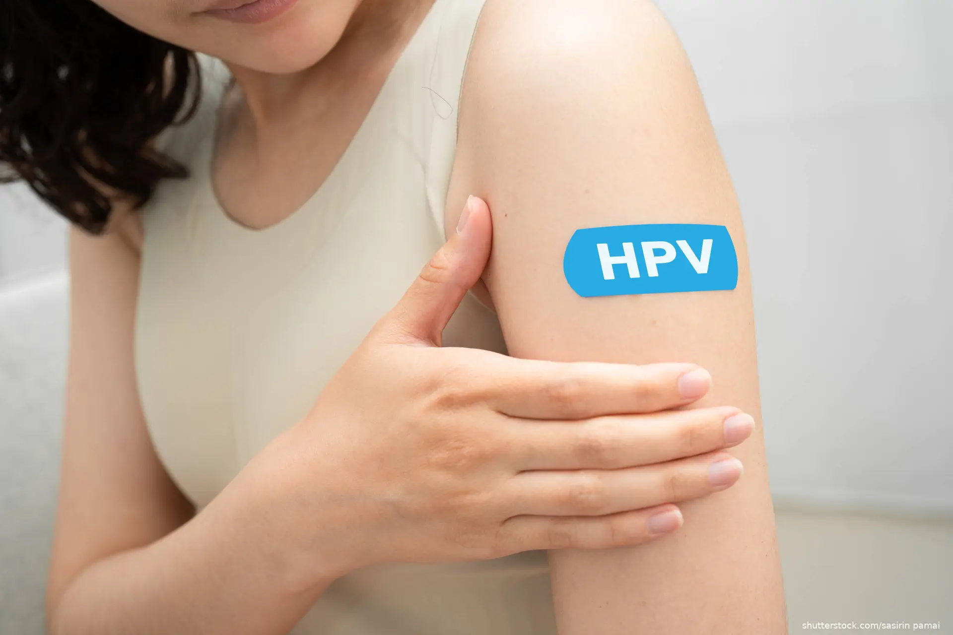 HPV written on bandaid on arm