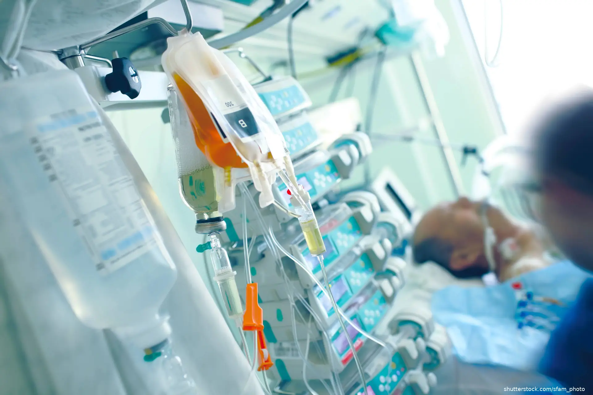 antibiotic IV drip hanging near patient in hospital bed