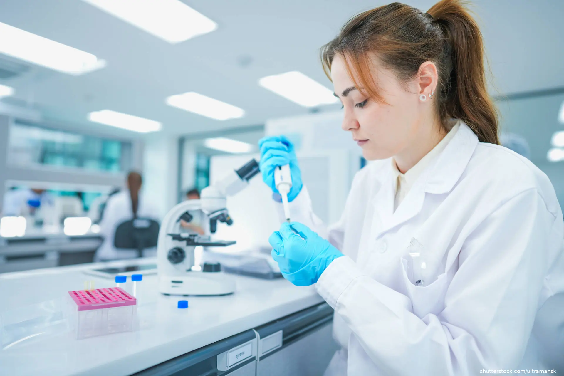 technician performing genome sequencing in a lab