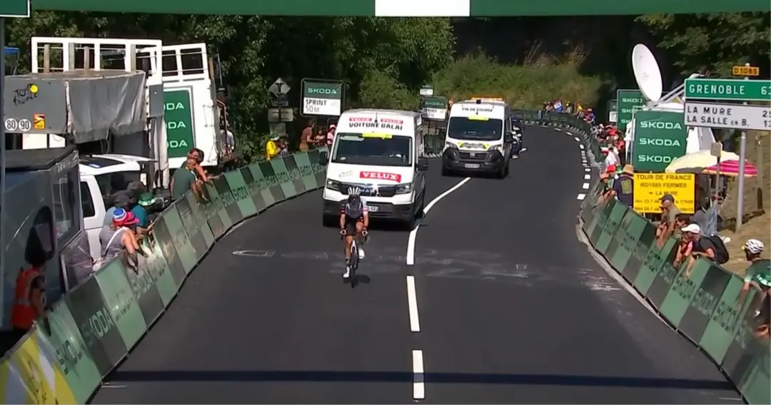 Brandon McNulty crossing the intermediate sprint by himself, before withdrawing from the Tour de France