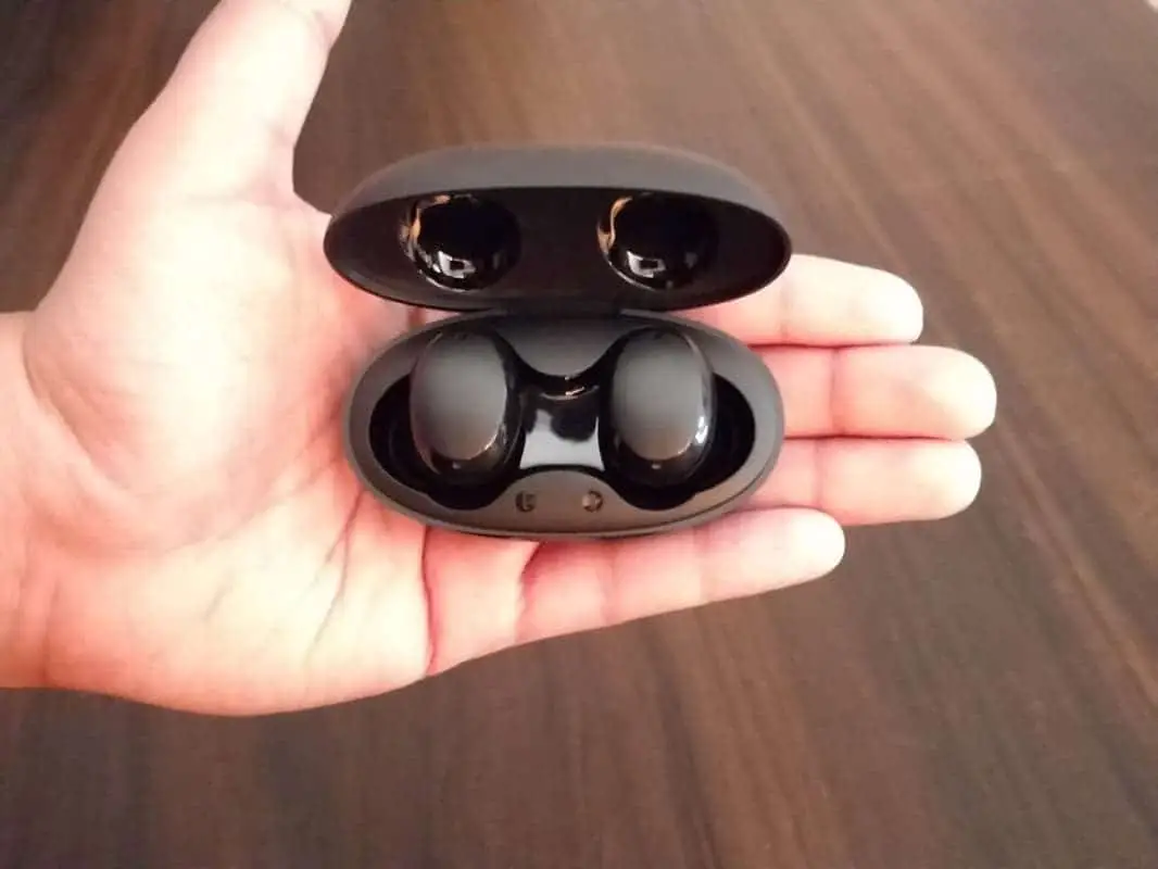 baseus encok w11 true wireless earbuds in palm
