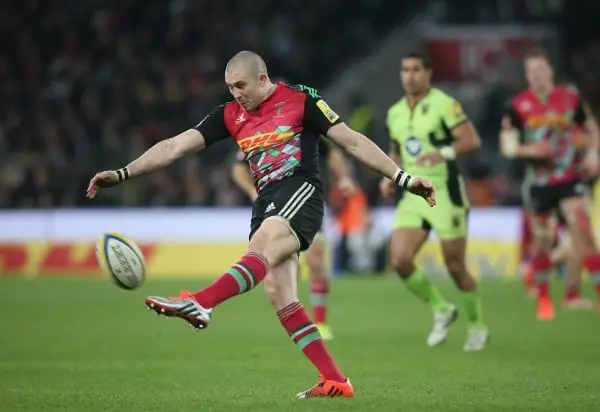 LONDON, ENGLAND - DECEMBER 27: Mike Brown of Harlequins kicks the ball upfield during the Aviva Premiership match between Harlequins and Northampton Saints at Twickenham Stadium on December 27, 2014 in London, England. (Photo by David Rogers/Getty Images)