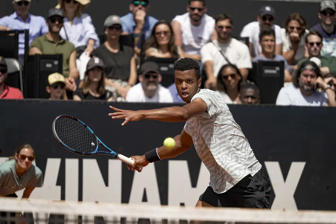 Mpetshi Perricard hitting a forehand at the 2024 Lyon Open