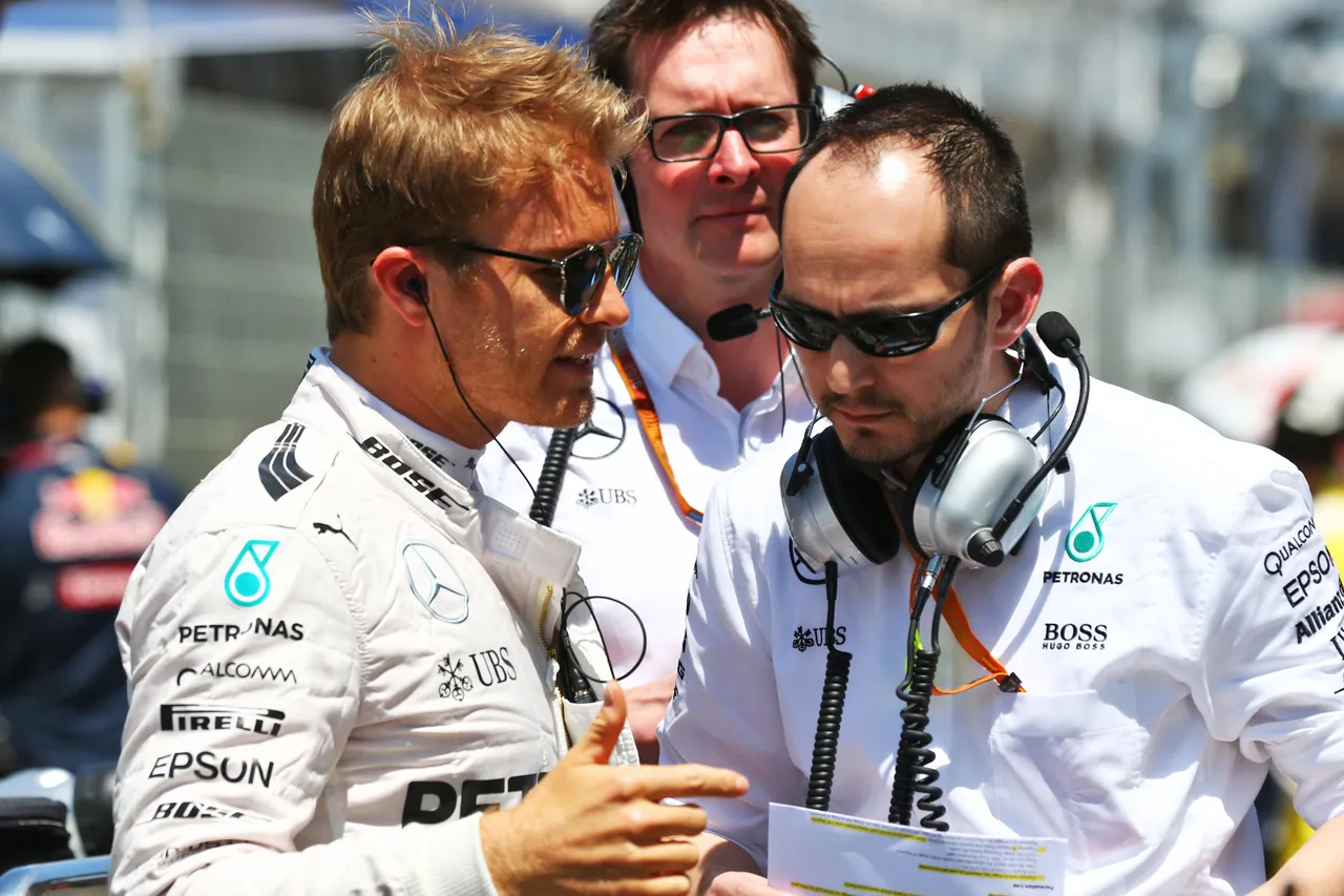rosberg speaking to race engineer prior to the start of the spanish gp