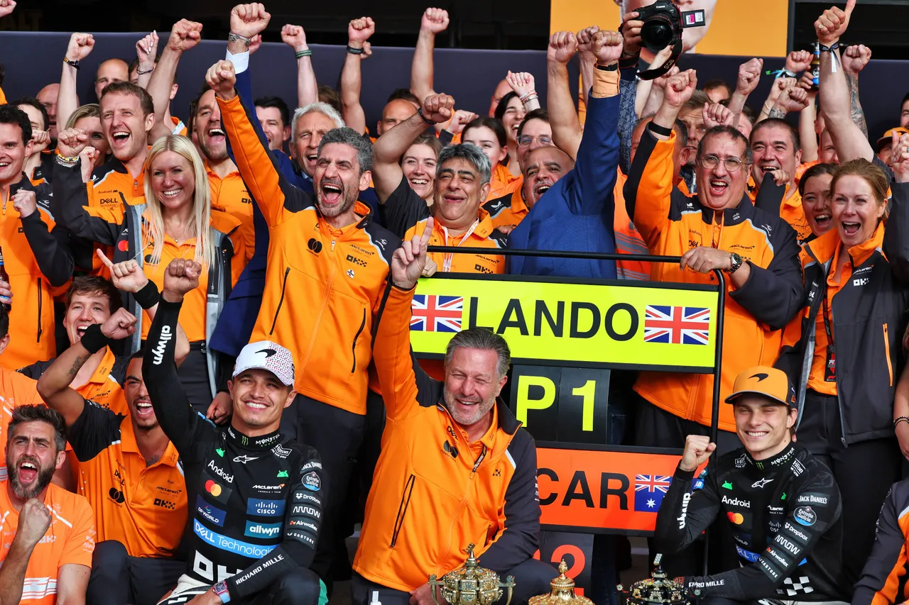 Zak Brown celebrates Hungarian GP success with Lando Norris and Oscar Piastri