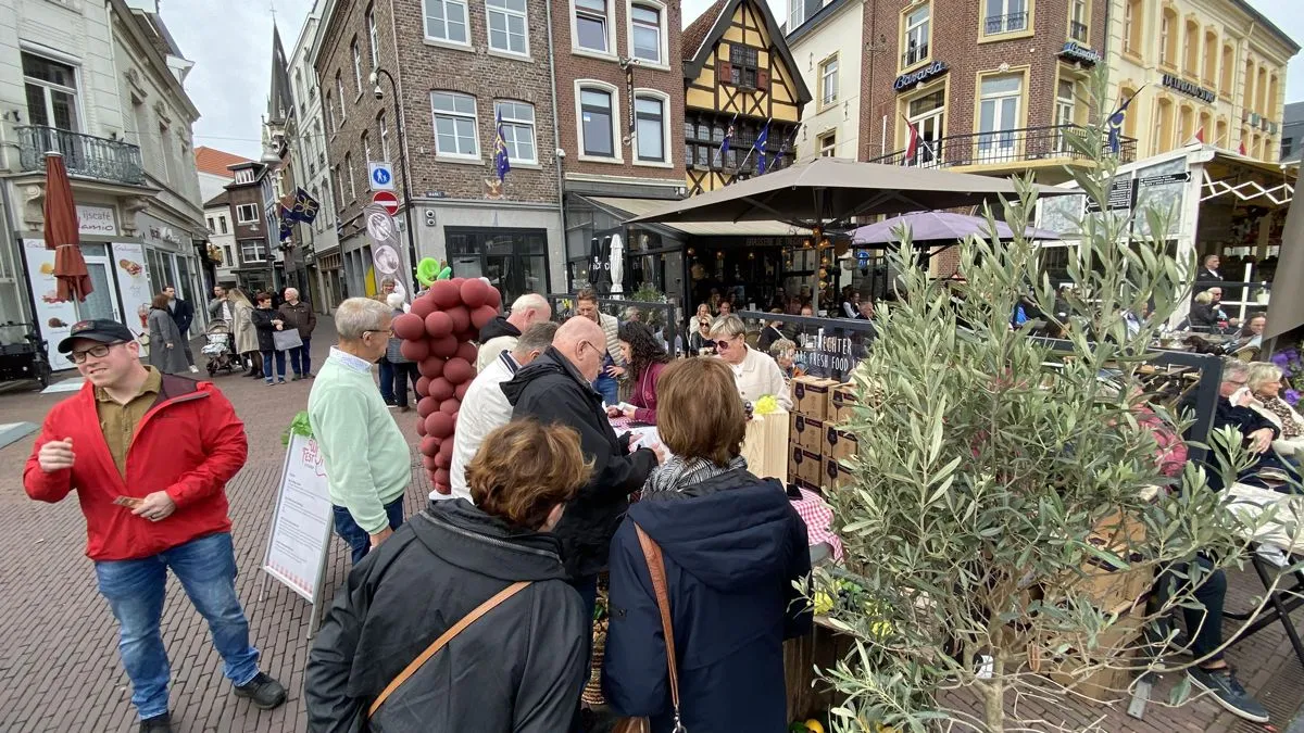 In de rij voor bonnen en proefglazen