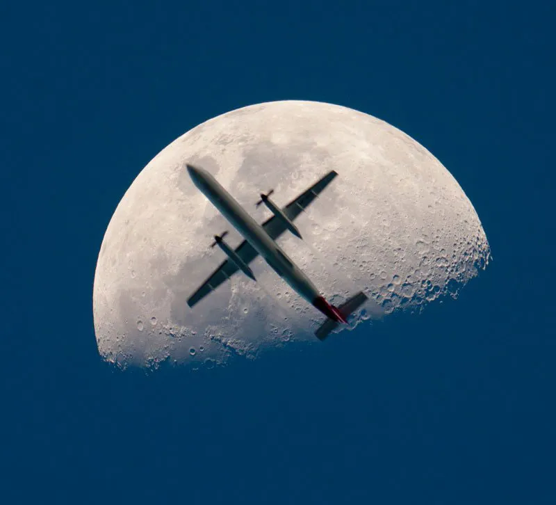 airplane passing the mooon perfect timing