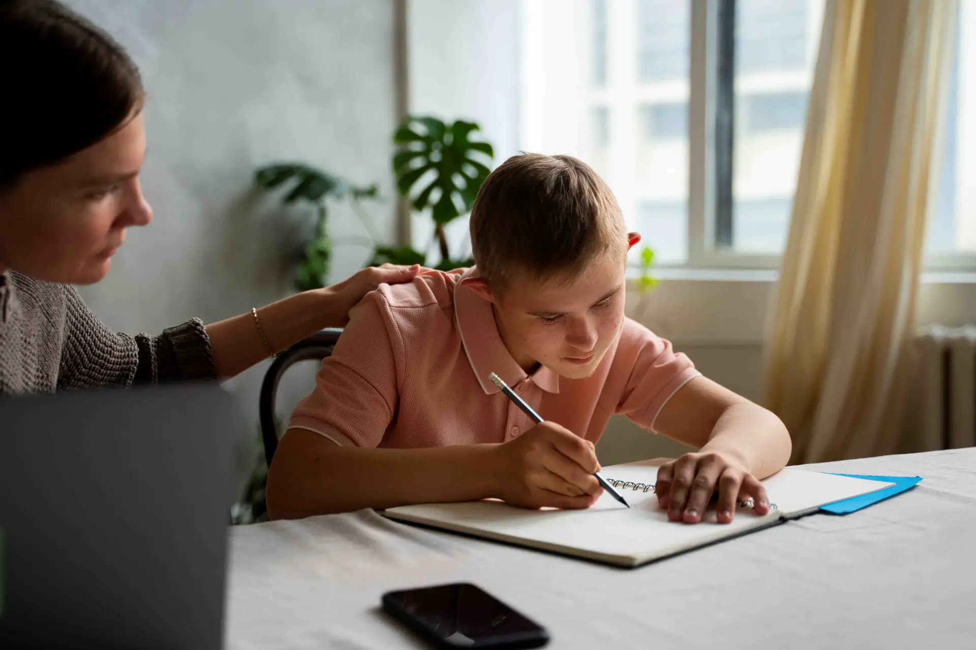 side view boy woman with laptop