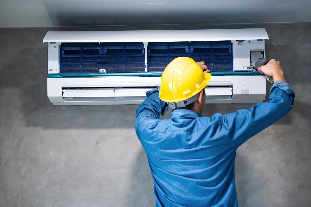 technician man repairing cleaning maintenance air conditioner3