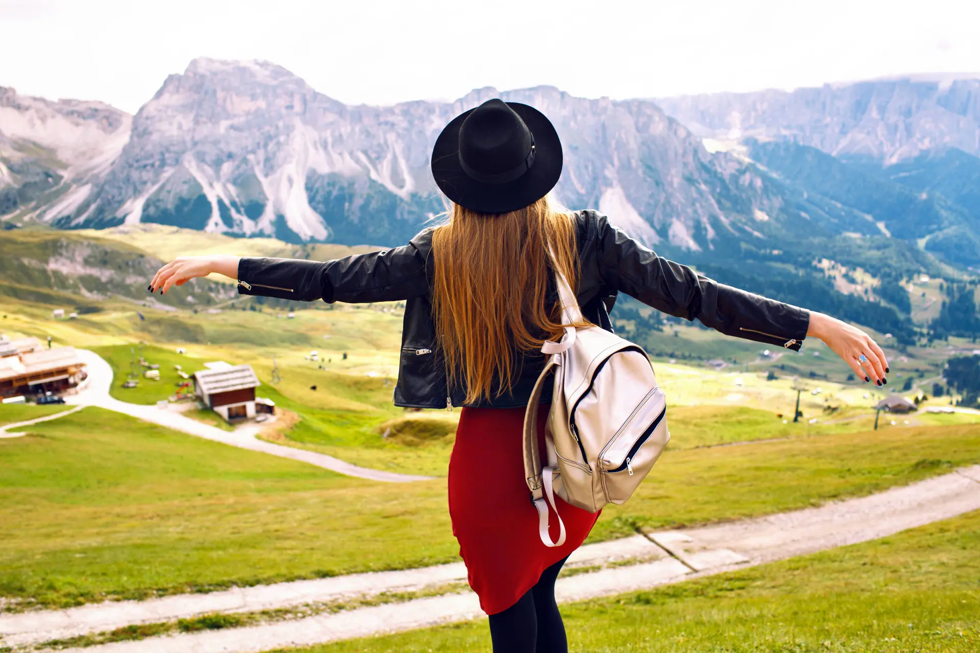 amazing-traveling-experience-image-beautiful-stylish-woman-posing-back-looking-breathtaking-mountains-view-trip-italian-dolomites-hipster-girl-enjoying-adventures